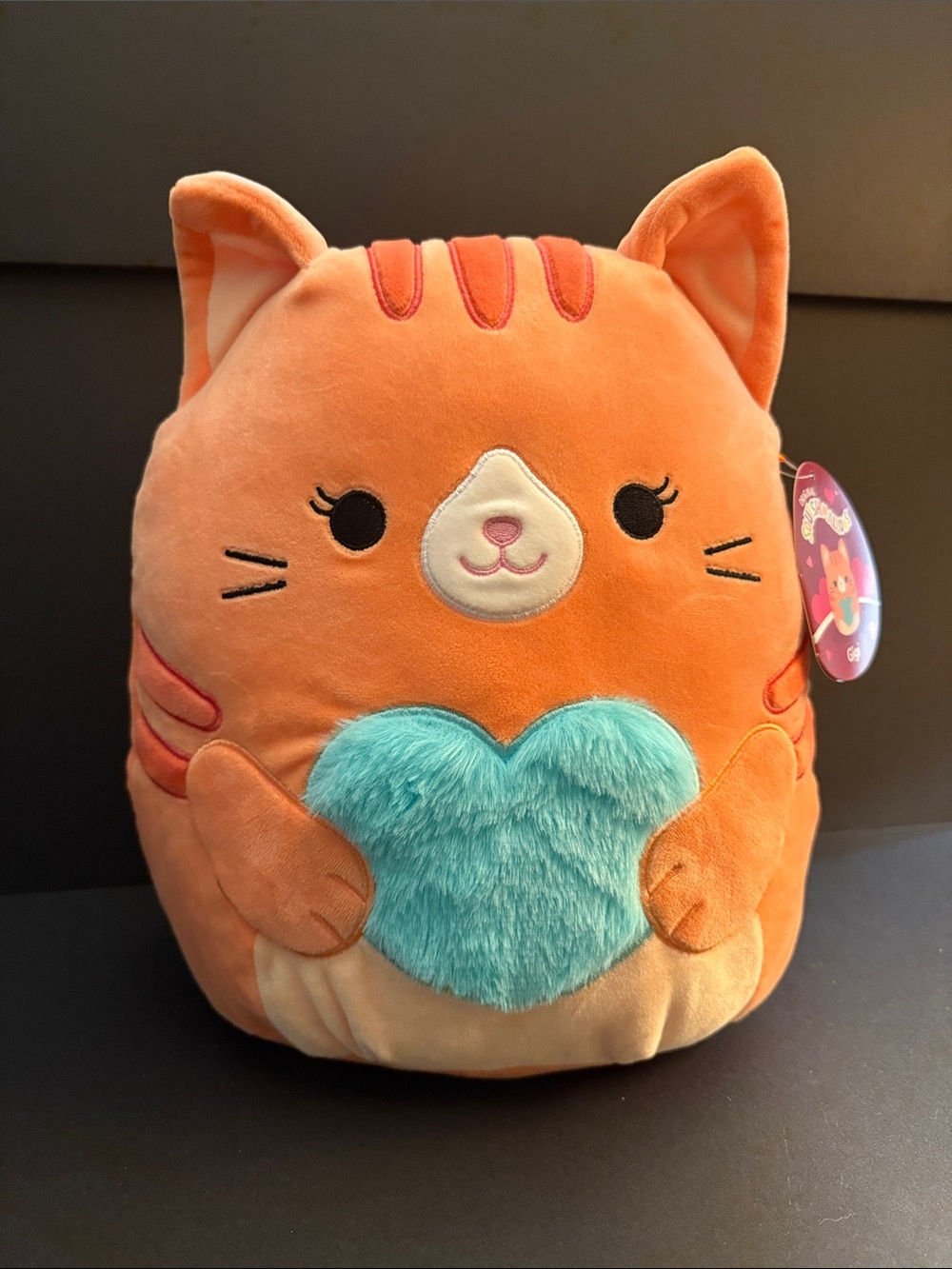 Squishmallows - Orange Cat “Gigi” Plush with Teal Heart